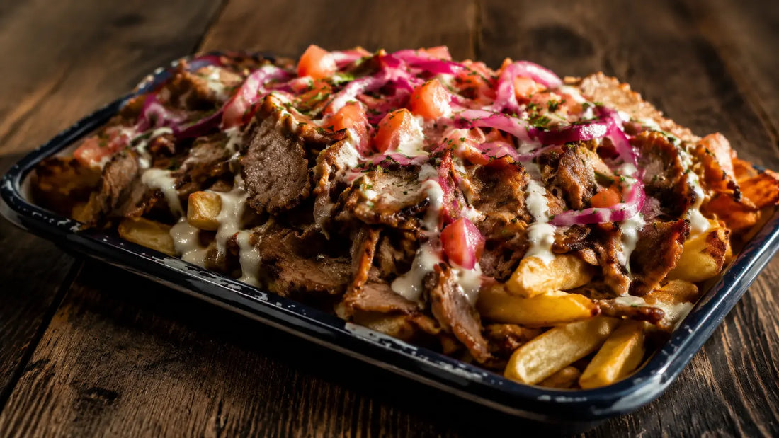 Beef shawarma loaded fries topped with spiced beef, garlic sauce, red onion and fresh herbs.
