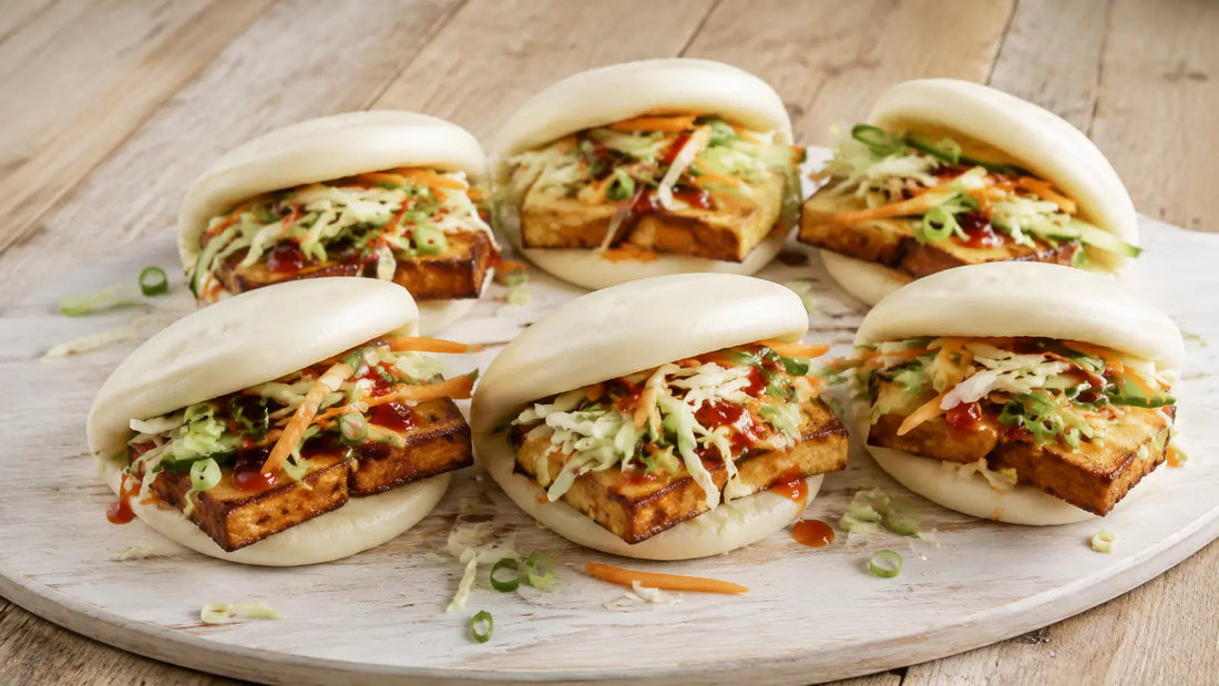 Chinese Five Spice crispy tofu bao buns with cabbage, cucumber, carrot, spring onions and chilli sauce.