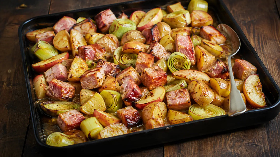 Gammon Rub traybake with roasted gammon, baby potatoes, leeks and apple wedges.