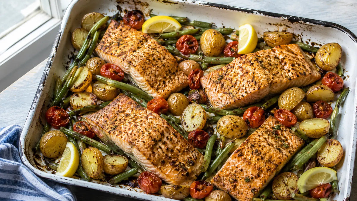 Garam Masala salmon traybake with baby potatoes, green beans, cherry tomatoes and lemon.