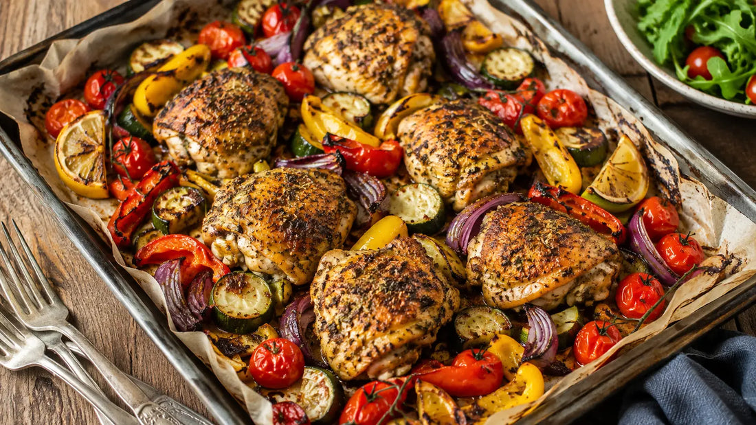 Mediterranean Seasoning chicken traybake with courgette, peppers, red onion, cherry tomatoes and roasted lemon.