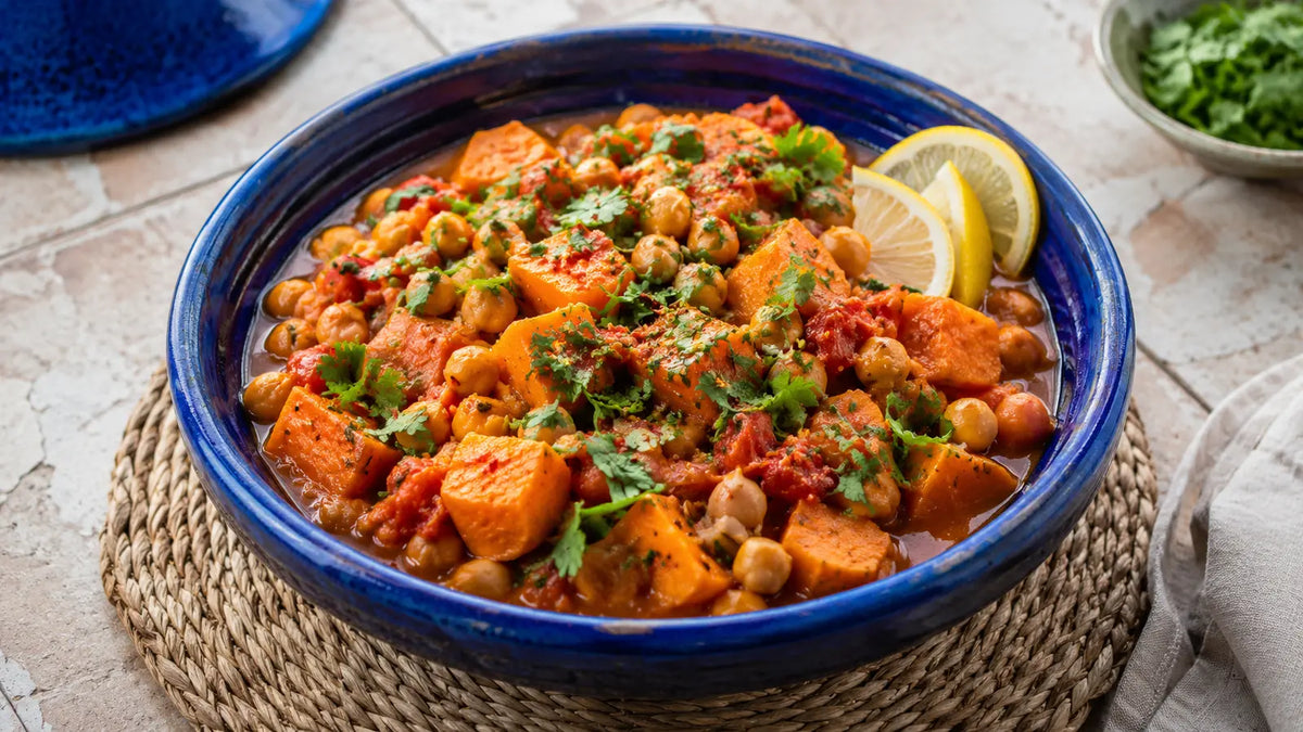 Moroccan Tagine sweet potato and chickpea stew with coriander and lemon.