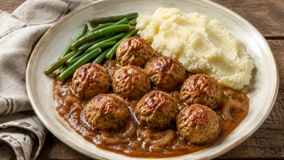 Roast Chicken Seasoning turkey meatballs in caramelised onion gravy with mashed potato and green beans.