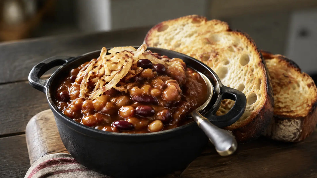 Homemade Smokey Bean barbecue baked beans with crisp onions and toasted sourdough.