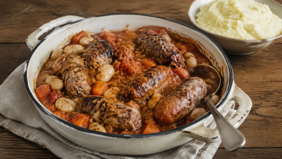 Smokey Bean sausage and butter bean casserole with carrots and creamy mashed potato.