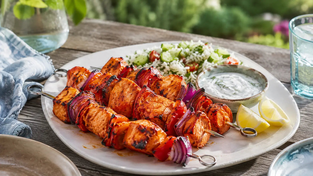 Tandoori salmon skewers with red pepper and onion, served with mint yoghurt, lemon and herbed rice salad.