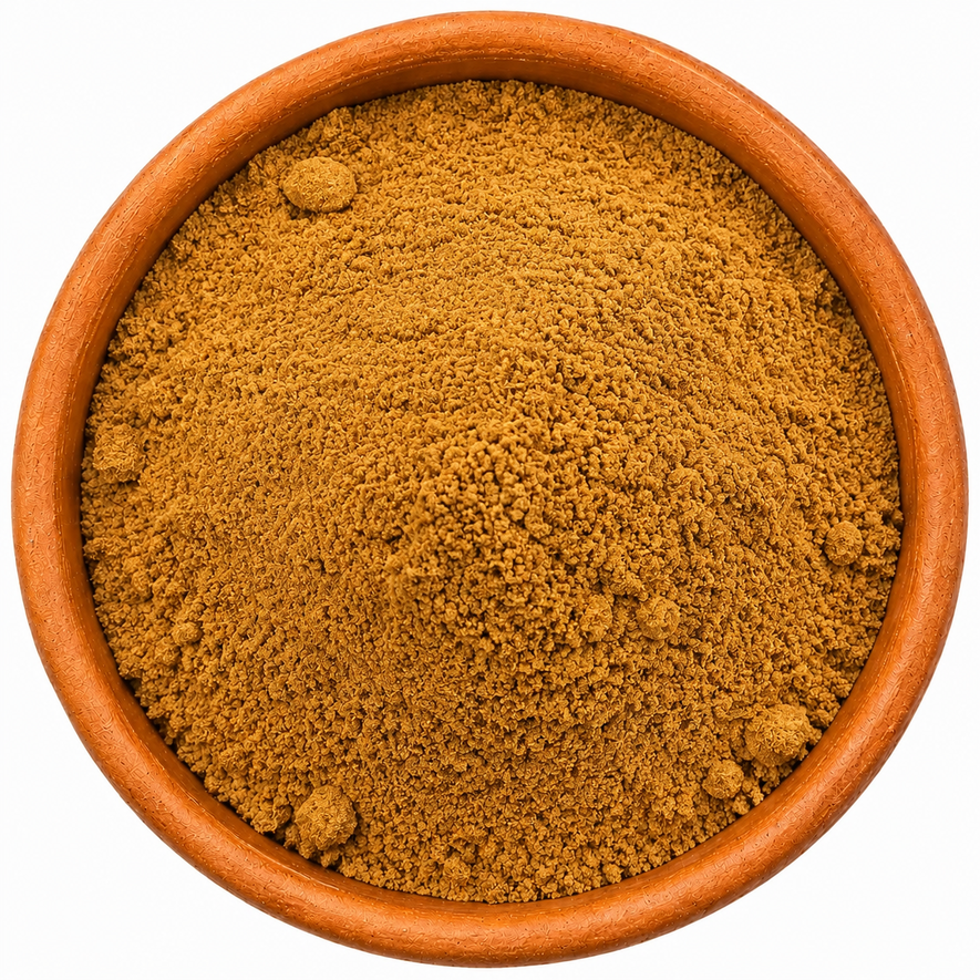 Apple Pie Spice Blend in a rustic terracotta dish, photographed from above on a clean white background.