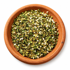 Italian Seasoning herb blend in a rustic terracotta dish on a white background.